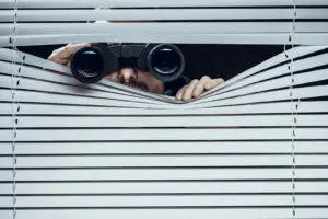 Spy at work. Man with binoculars.
