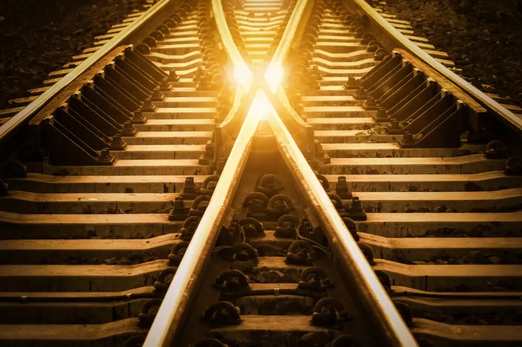 An image of two railroad tracks crossing over each other.